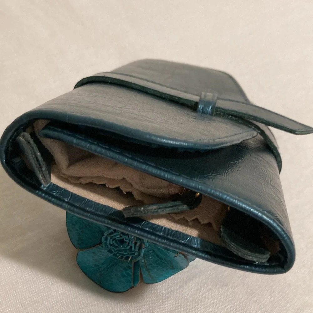 Mele & Co jewelry roll travel case teal blue